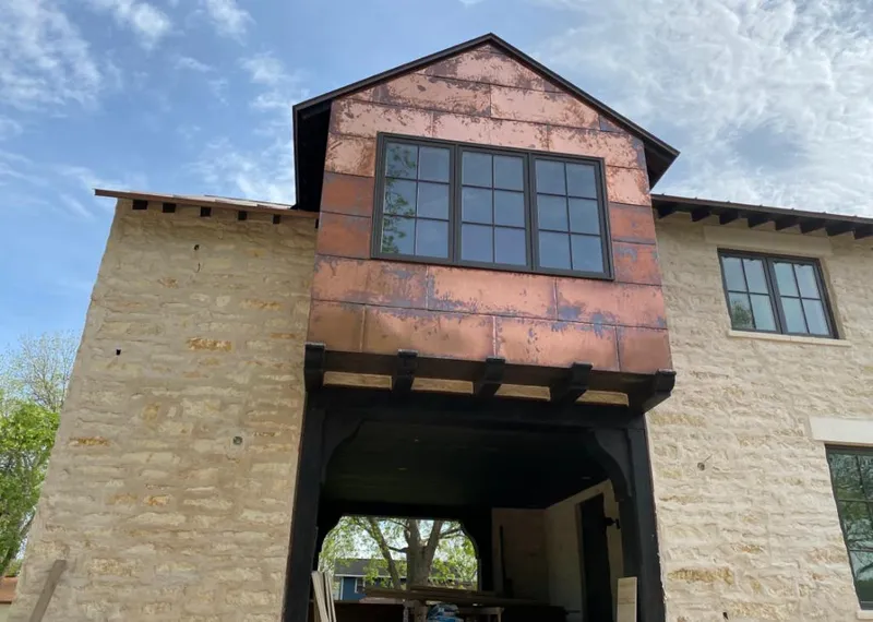 Copper metal panel facade on a stone building for Skylight Installation in Novato