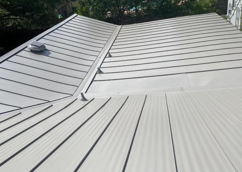 Solar attic fan installed on a metal roof for Roof Ventilation in Novato